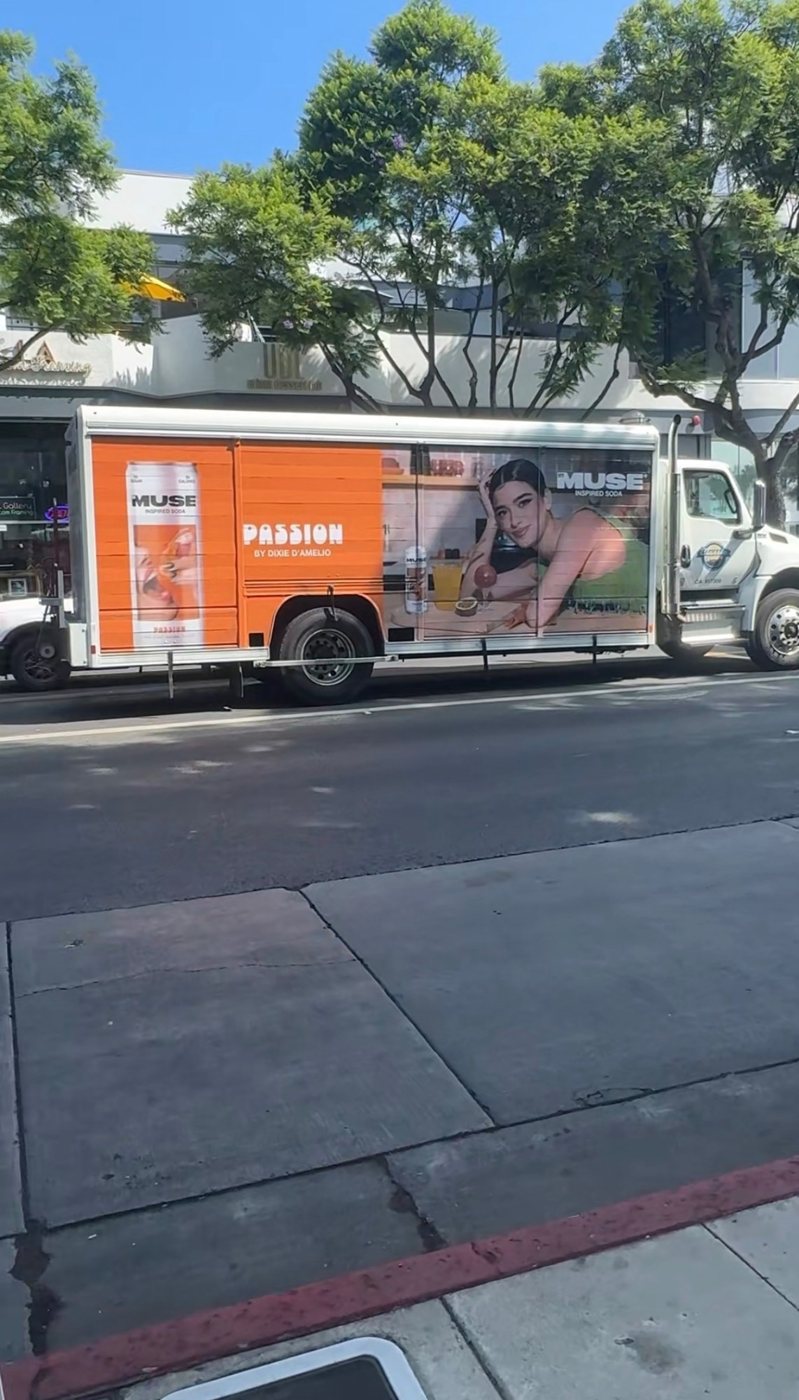 A delivery truck wrapped for Passion by Dixie D’Amelio, Muse inspired soda